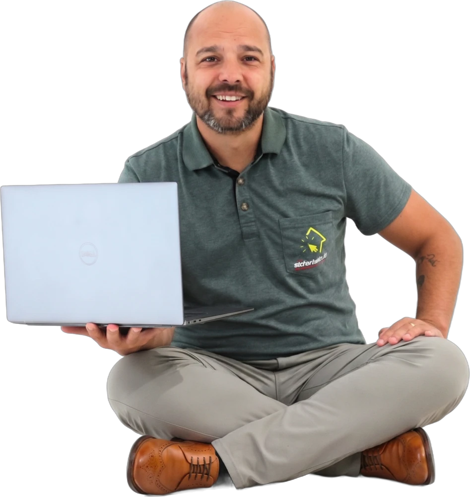 Sebastien, from Sédentaire, sitting on the floor with a laptop